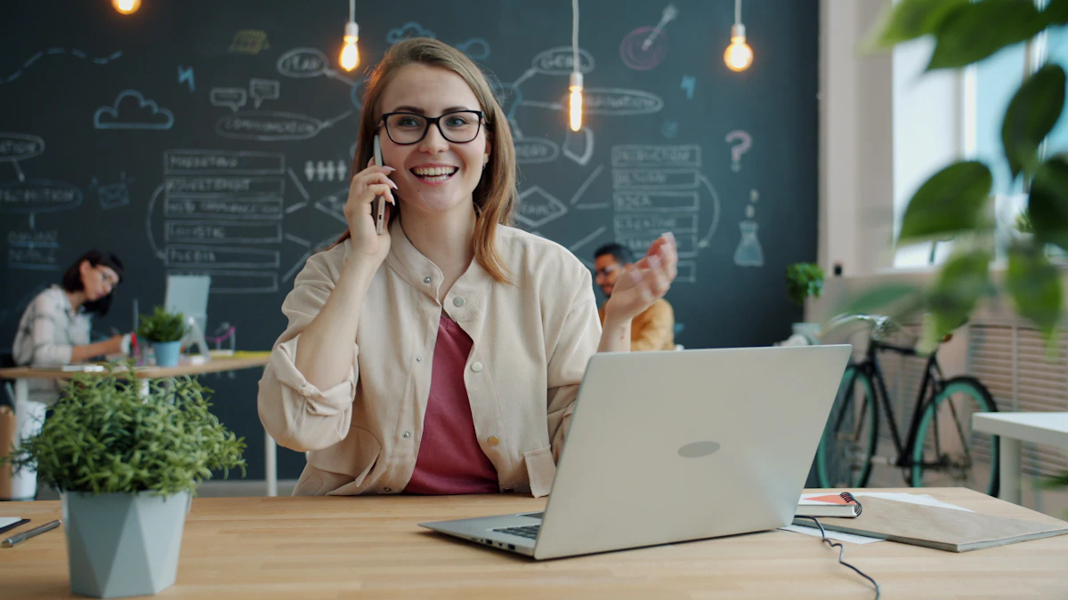 A friendly team member on a phone call in a bright office